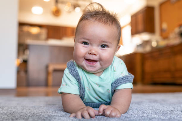 Baby laying on carpet flooring | Wacky's Flooring
